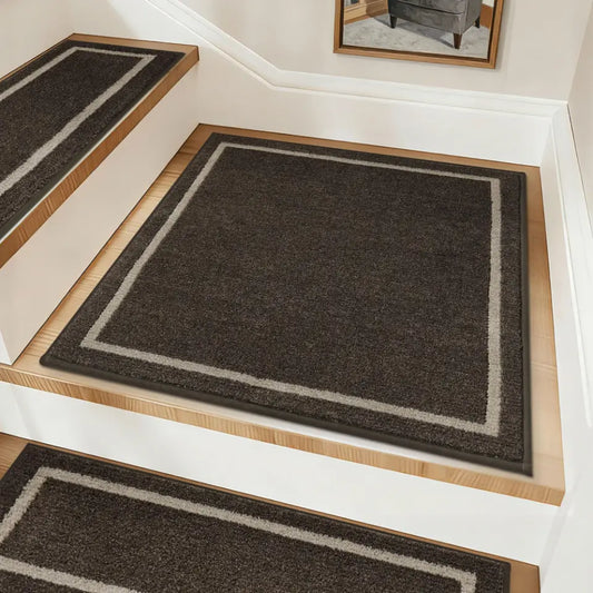 Brown stair runners with a light border on wooden steps.