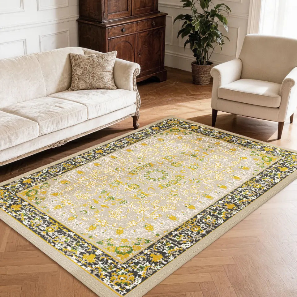 Decorative gold & charcoal area carpet with floral pattern in a living room setting