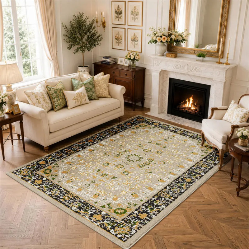 Decorative gold & charcoal area carpet with floral pattern in a living room setting