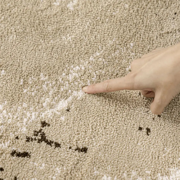 Textured area rug with a pattern on a wooden floor