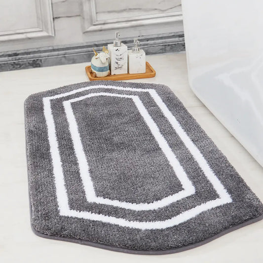 Grey Luxury Plush Oval Bath Rugs in front of Hot Tub