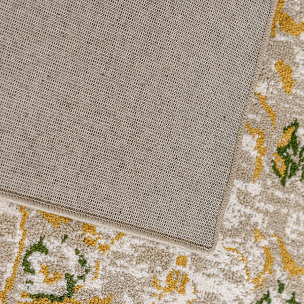 Patterned rug with a textured border on a wooden floor