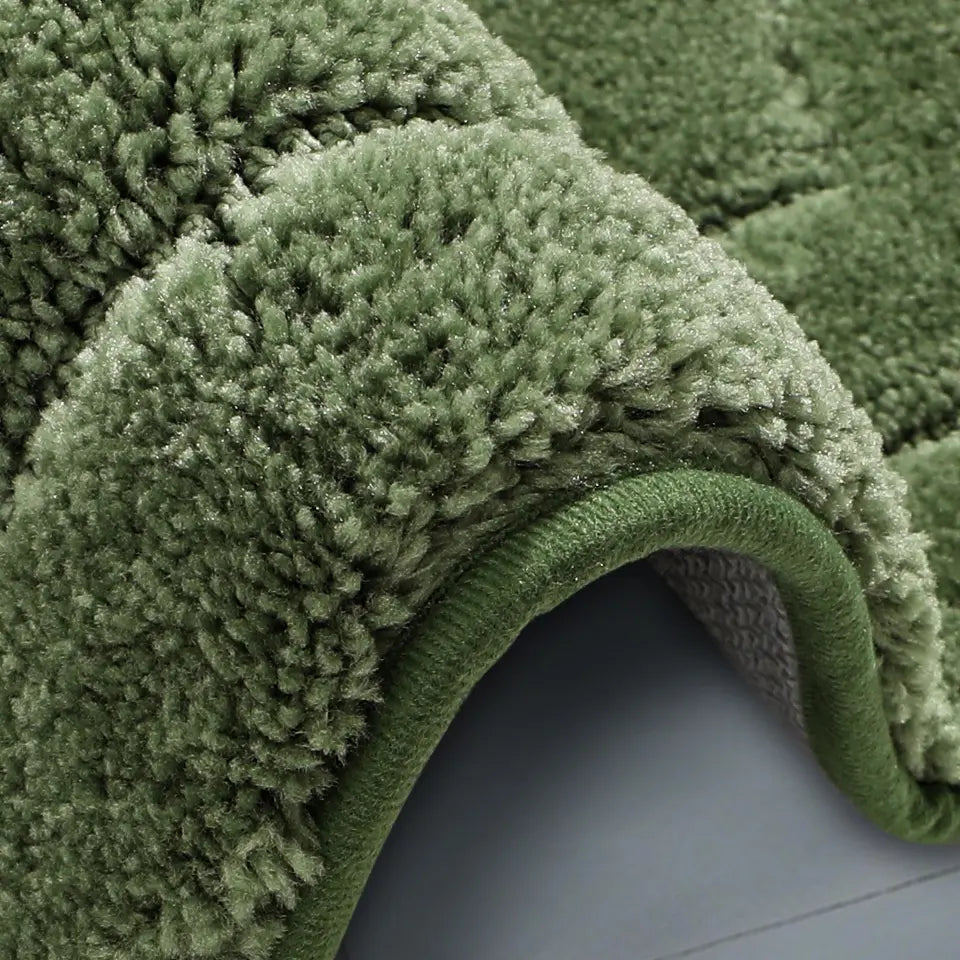 Side View of Green Oval Fluffy Bath Rug