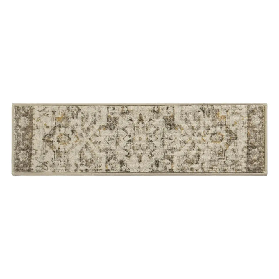Tan damask patterned rug on a white background