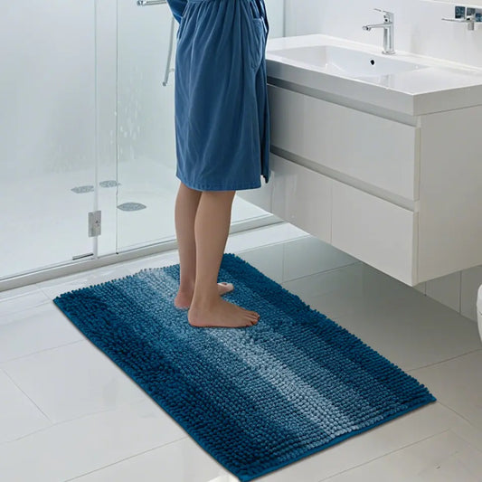 Woman Standing on Soft Teal Gradient Stripe Bath Rug