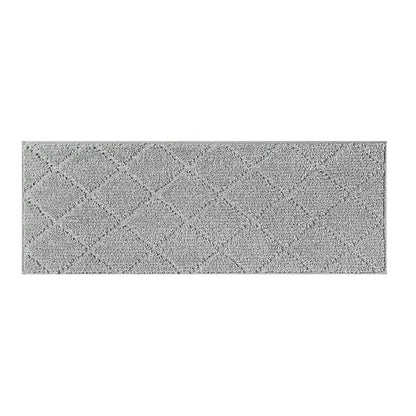 Rectangular grey stair mat with a textured surface on a white background