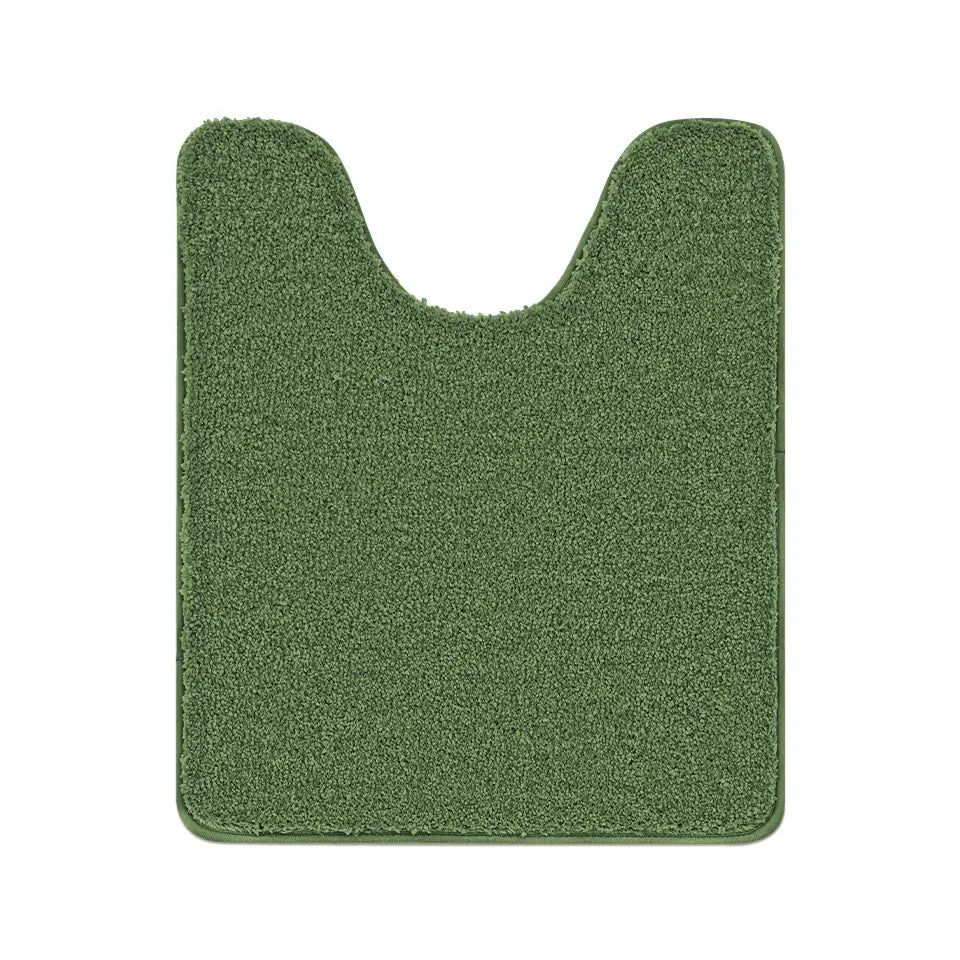 Green bath mat with a unique cutout design on a white background