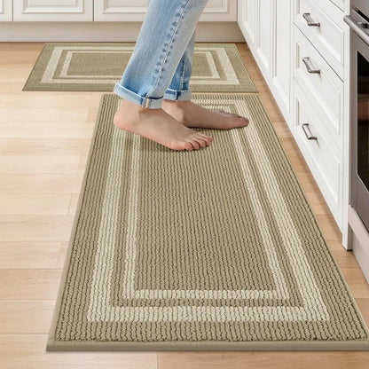 Person walking on a beige white frame patterned rug in a kitchen