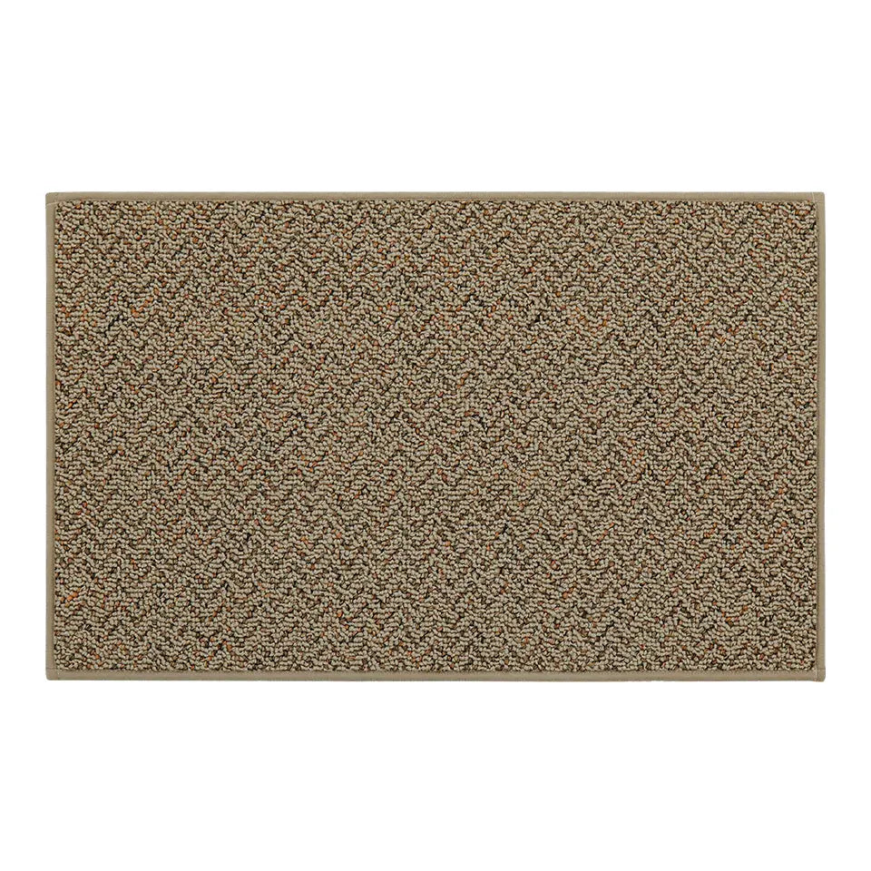 Taupe textured kitchen mat with a geometric pattern on a white background