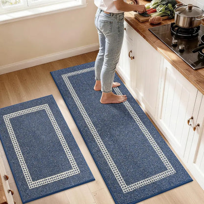 Person walking on a blue kitchen mat with white border in a home setting.