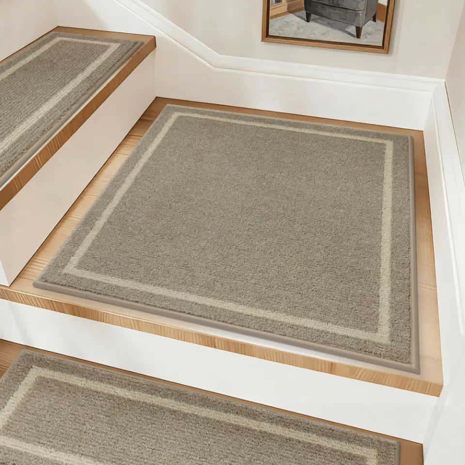 Beige stair runners on wooden stairs with a neutral background