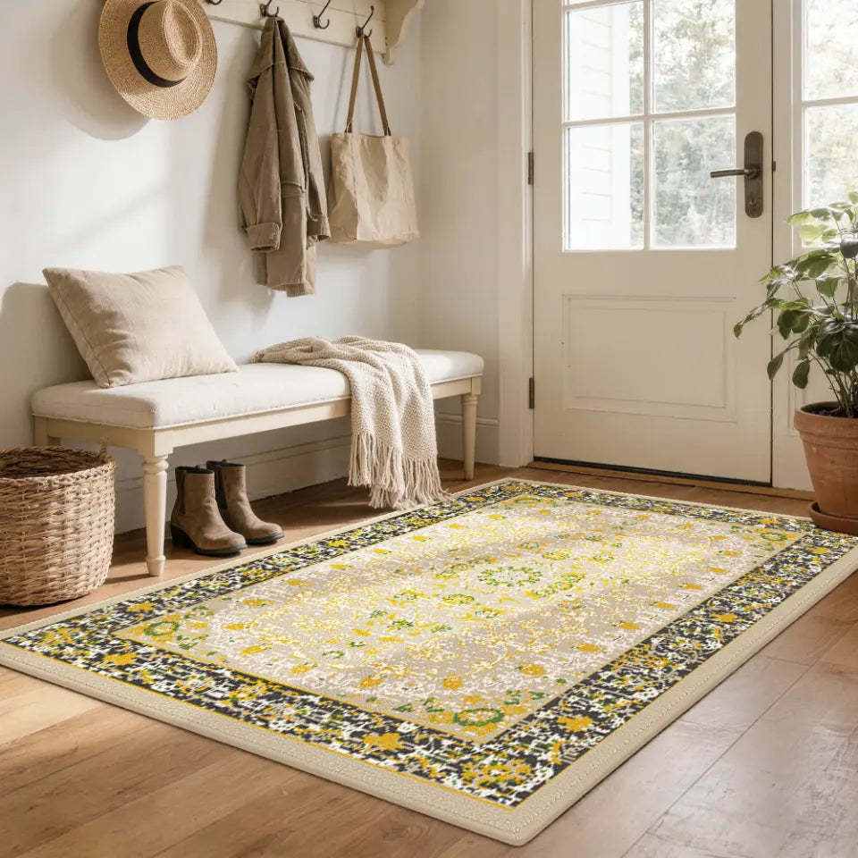 Decorative gold & charcoal rug with floral pattern in a home entryway.