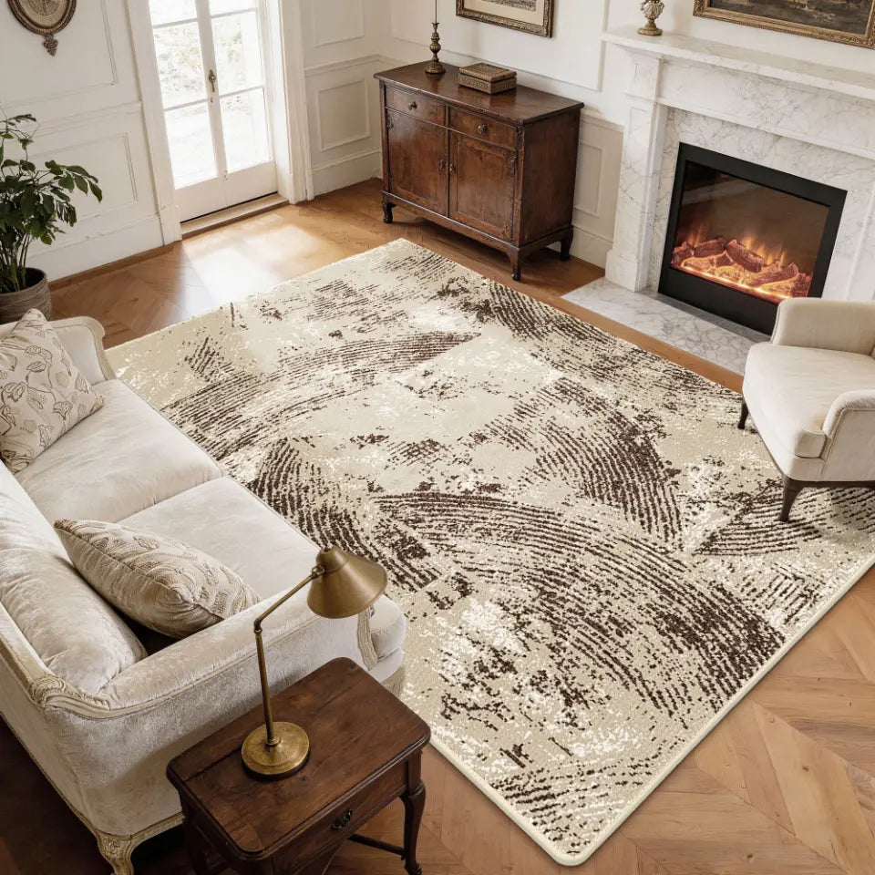 Living room with a large oatmeal & espresso patterned rug, sofa, and fireplace.