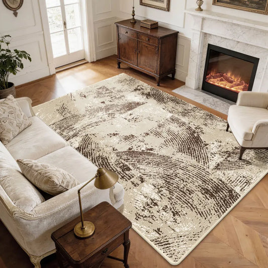 Living room with a large oatmeal & espresso patterned rug, sofa, and fireplace.