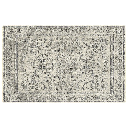 Grey and white patterned rug on a white background