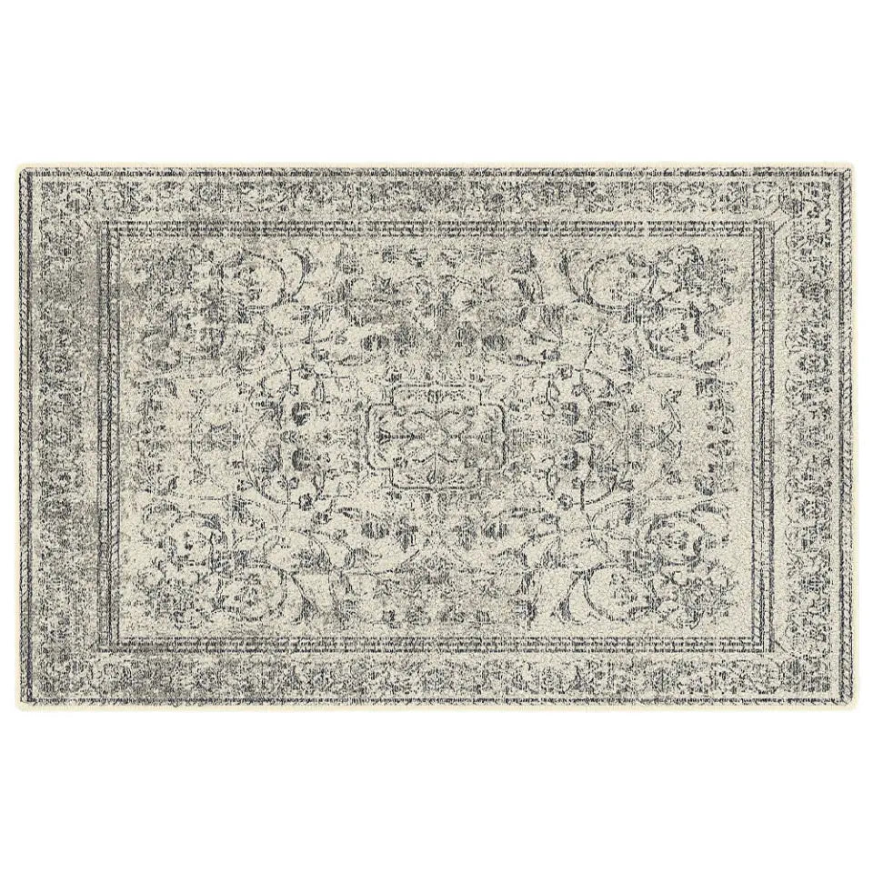 Decorative rug with intricate pattern on a white background