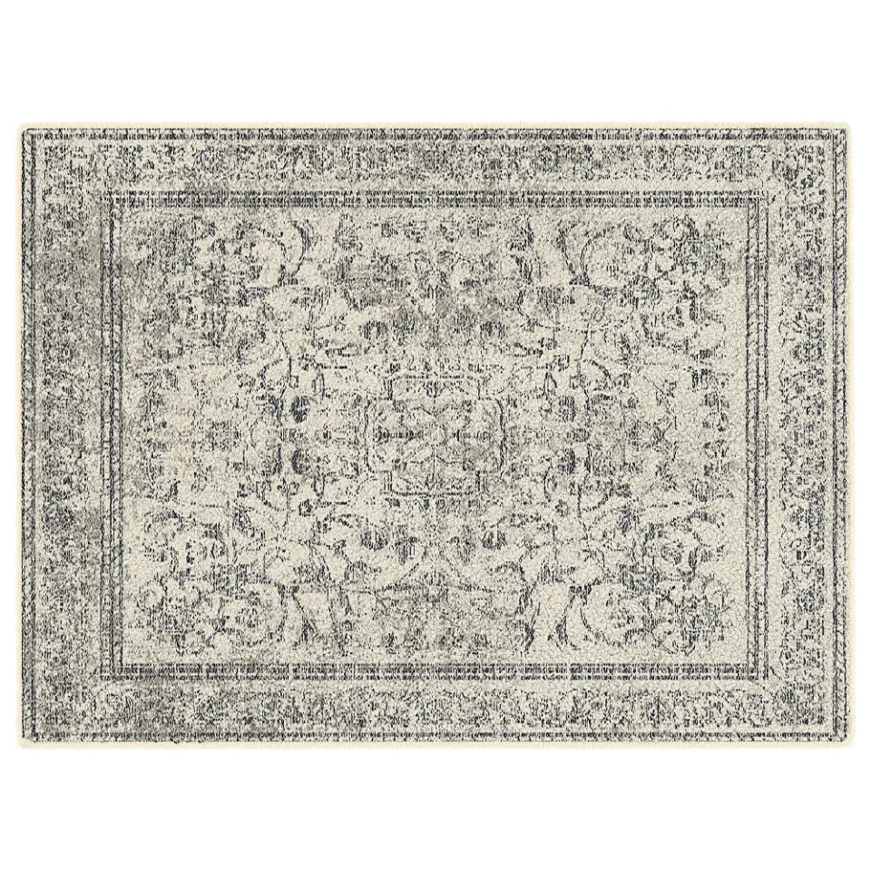 Decorative rug with intricate pattern on a plain white background