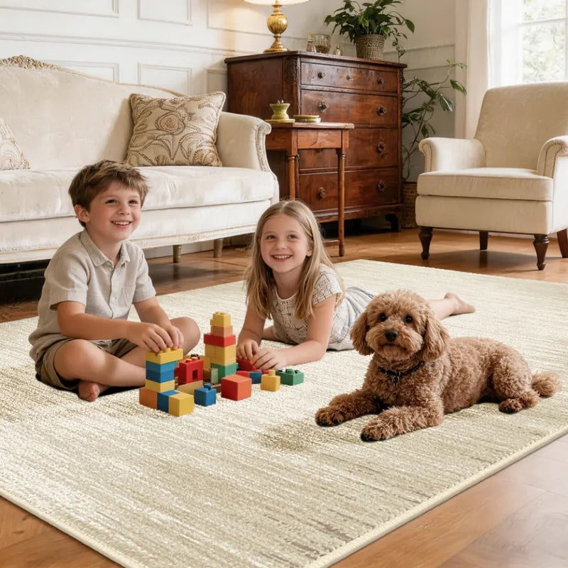 Two children playing with colorful blocks on a taupe & cream rug in a living room with a dog.