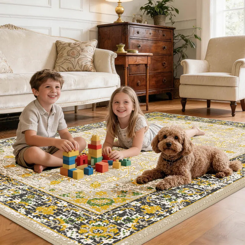 Two children playing with building blocks on a gold & charcoal patterned rug in a living room with a dog.