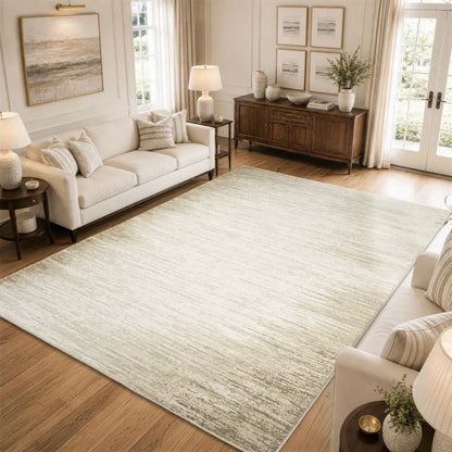 Living room with a large light-colored rug, white sofa, and wooden side table.