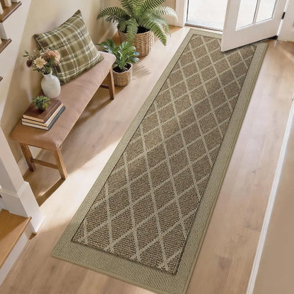 Beige long rectangular rug with a diamond pattern on a wooden floor, with a bench and plants in the background.