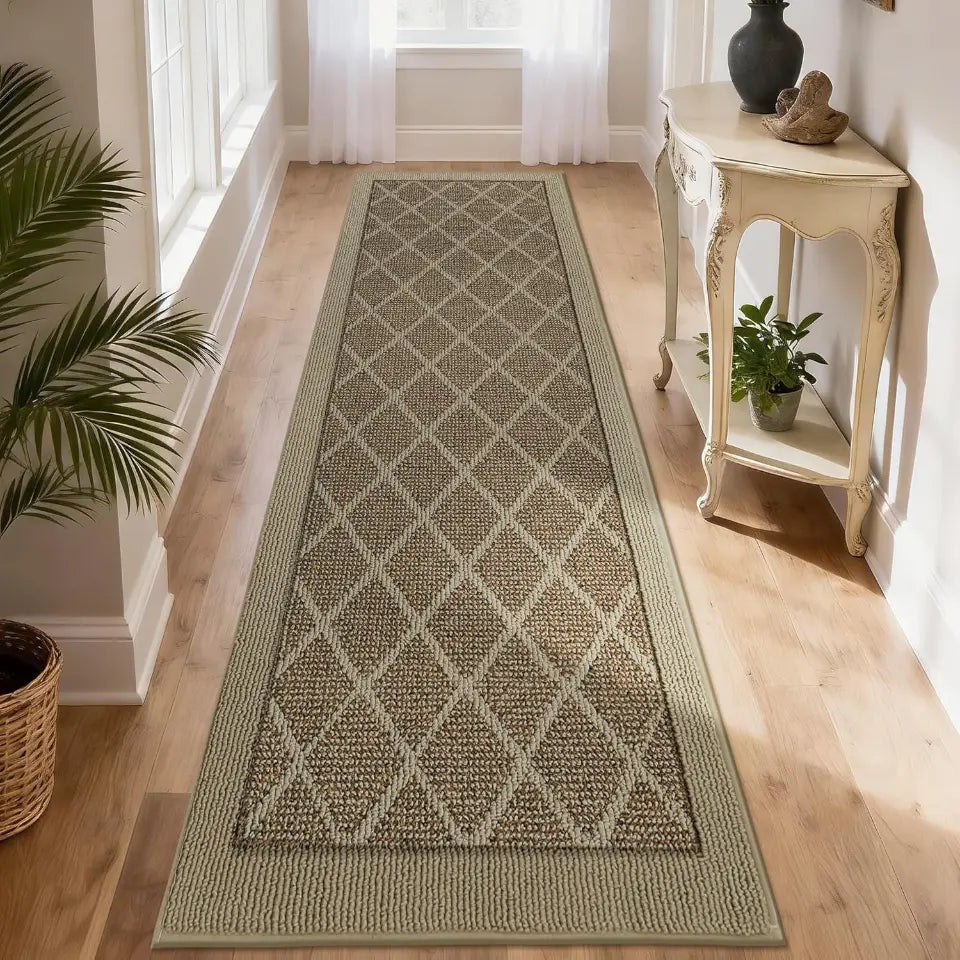 Long rectangular beige rug with a diamond pattern on a wooden floor, with a side table and plants in the background.