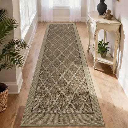 Long rectangular beige rug with a diamond pattern on a wooden floor, with a side table and plants in the background.