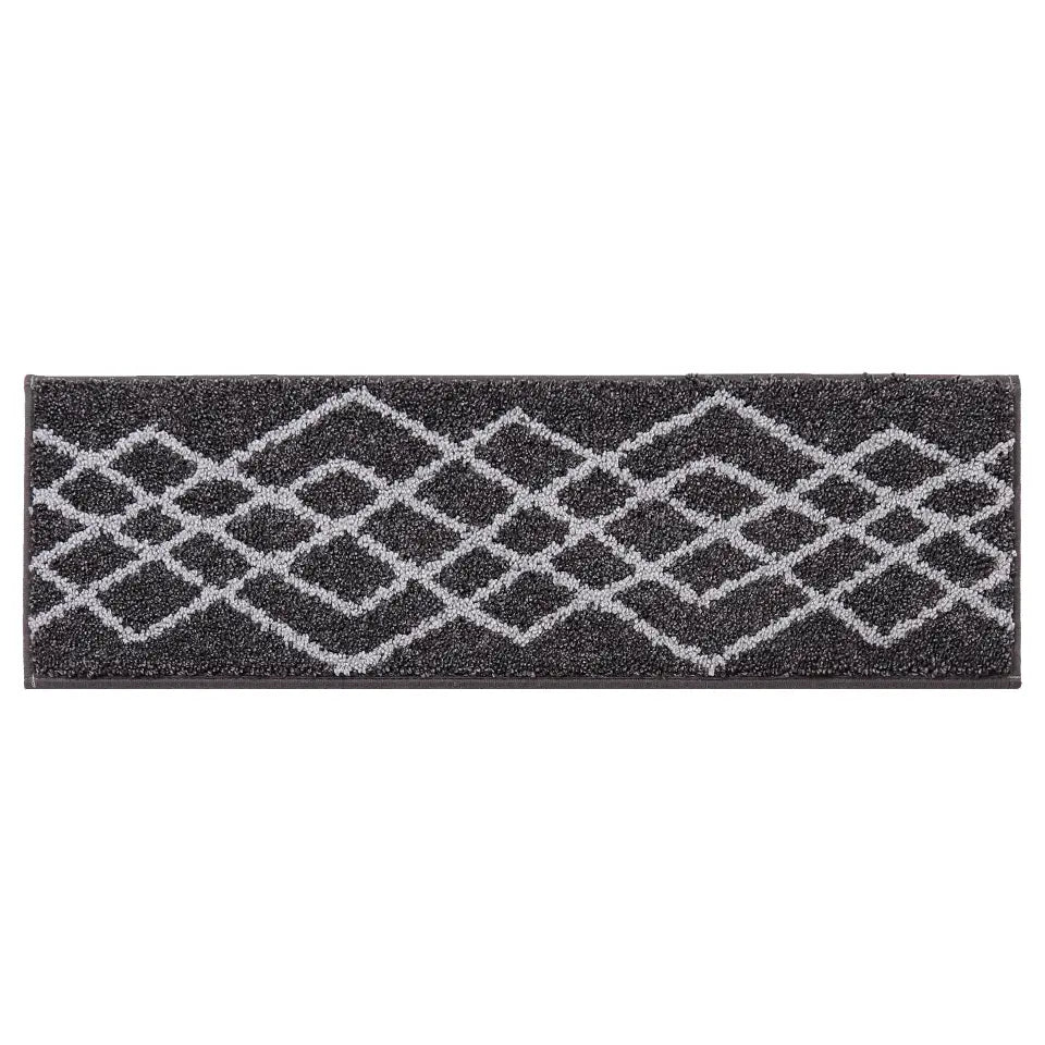 Black stair treads with geometric pattern on a white background