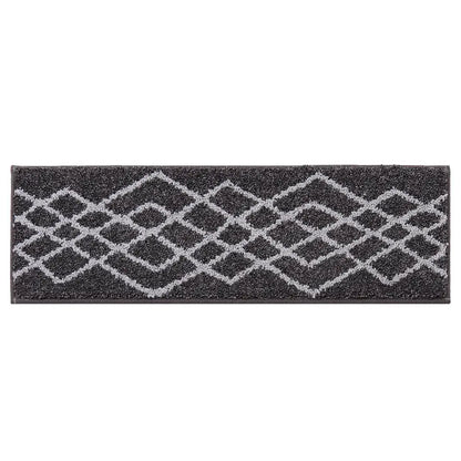 Black stair treads with geometric pattern on a white background