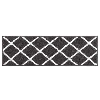 Black stair mat with white geometric pattern on a white background