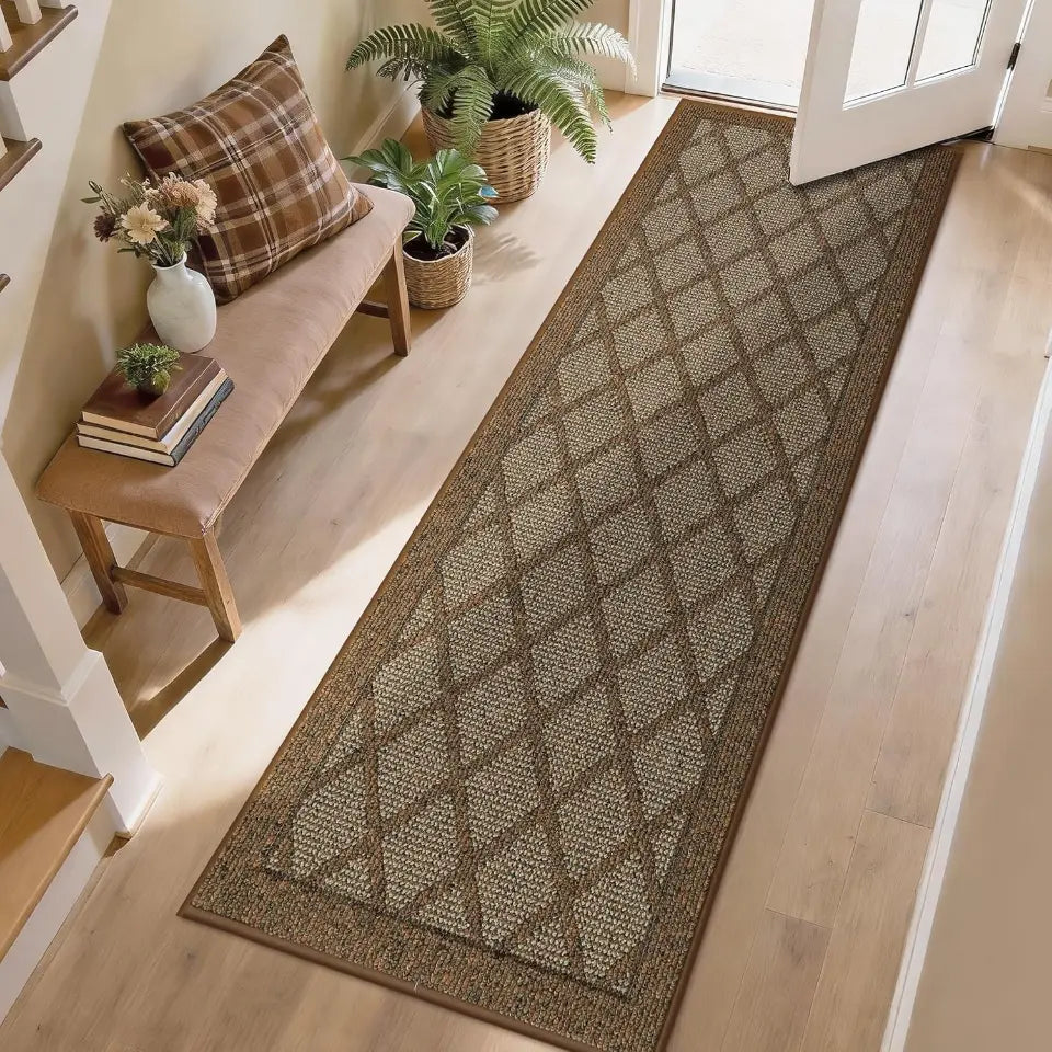 Long light brown runner rug on a wooden floor with a bench and plants in the background.