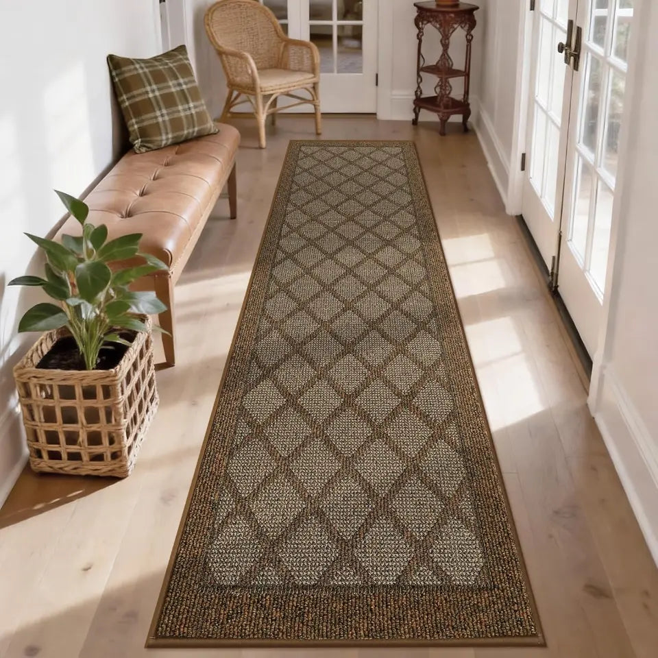 Long light brown diamond-patterned rug on a wooden floor with a bench, plant, and door in the background.