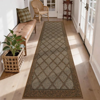 Long light brown diamond-patterned rug on a wooden floor with a bench, plant, and door in the background.