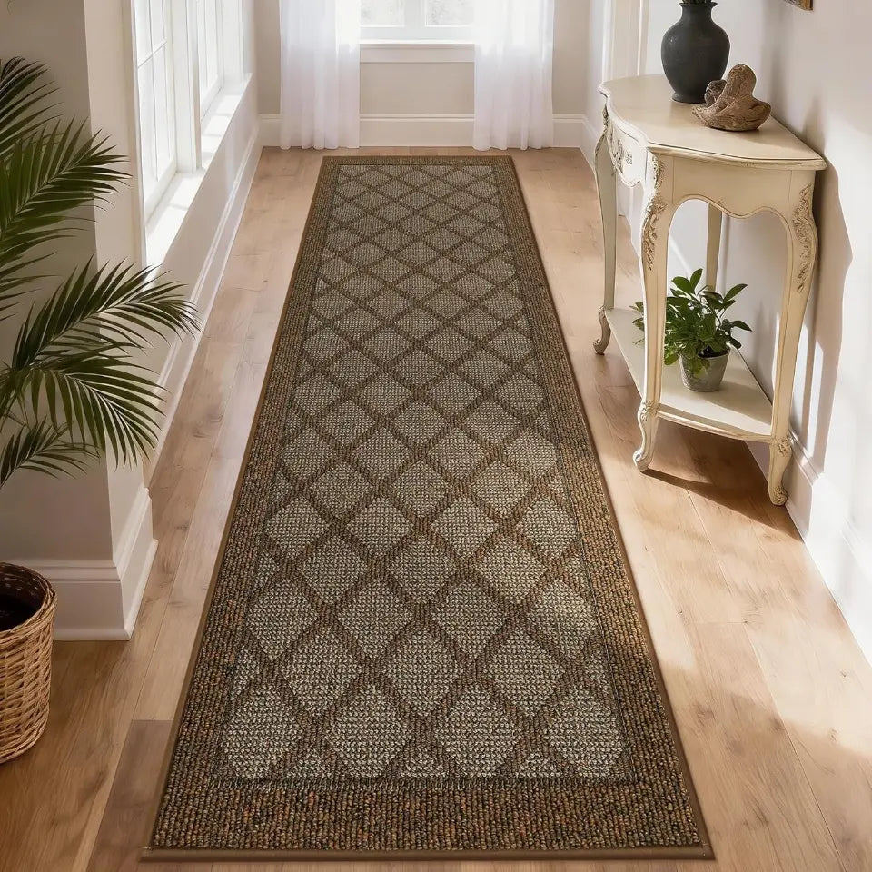 Long light brown diamond-patterned rug on a wooden floor with a side table and plants in the background.