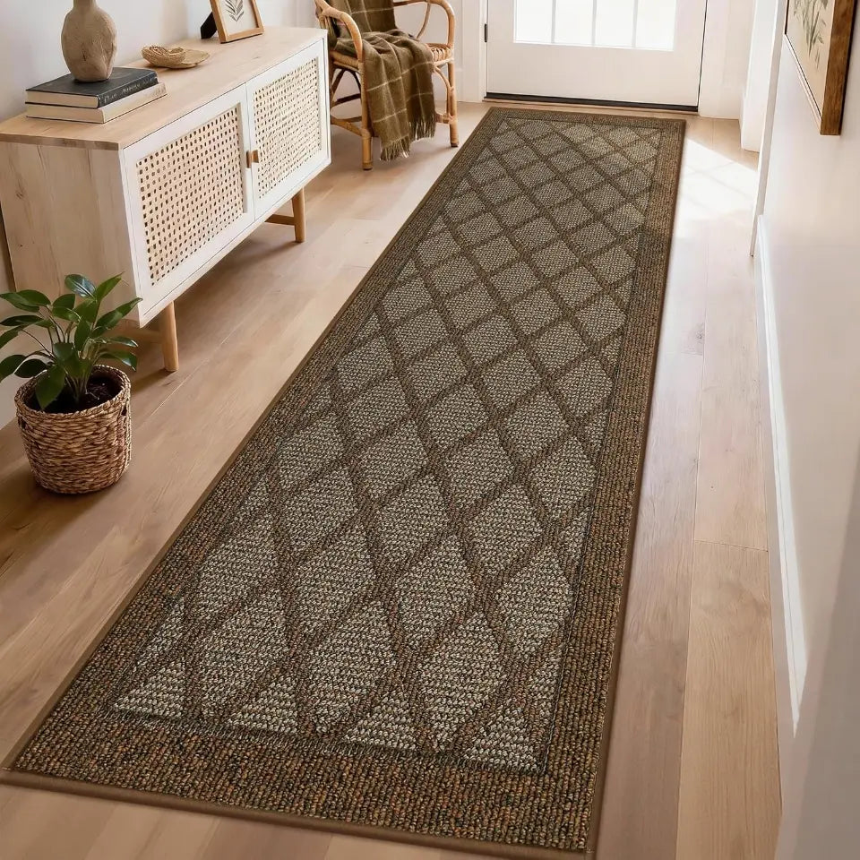 Long light brown runner rug on a wooden floor in a room with a sideboard and plant.