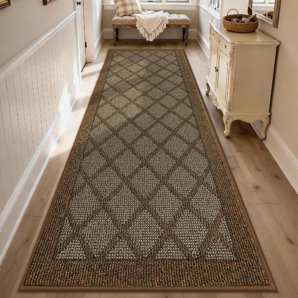Long rectangular light brown rug with a diamond pattern on a wooden floor in a home setting.