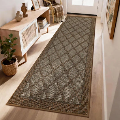 Patterned light brown rug on a wooden floor in a room with furniture and decor.
