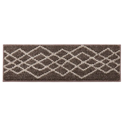 Brown and beige patterned rug on a white background