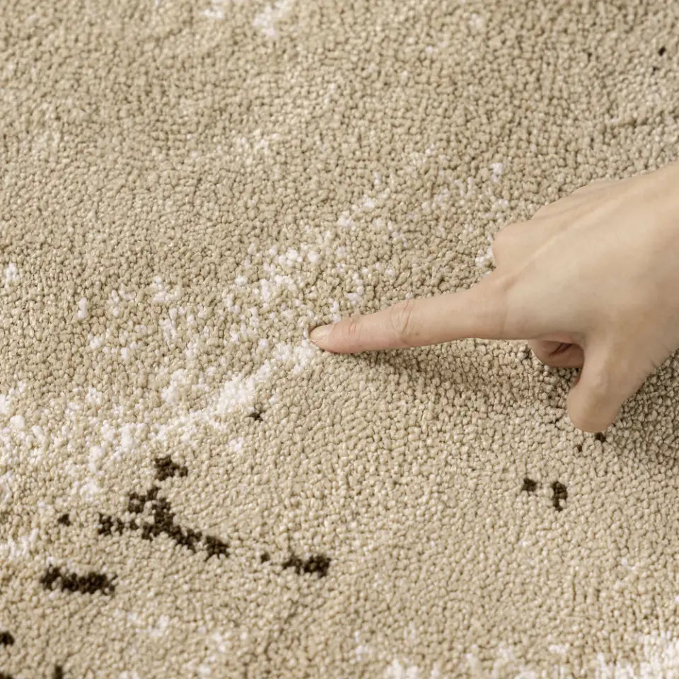 Textured area rug with a pattern on a wooden floor
