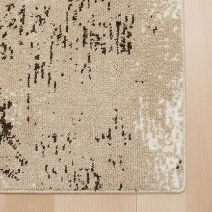 Textured area rug with a pattern on a wooden floor