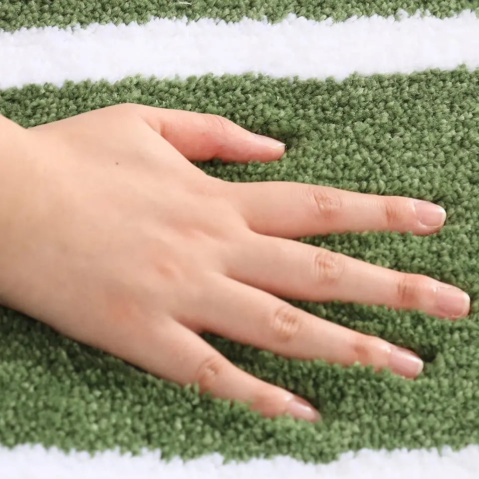 Hand on a textured surface with white stripes