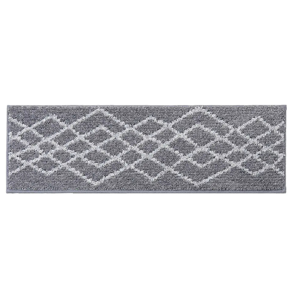 Grey stair treads with white geometric pattern on a white background