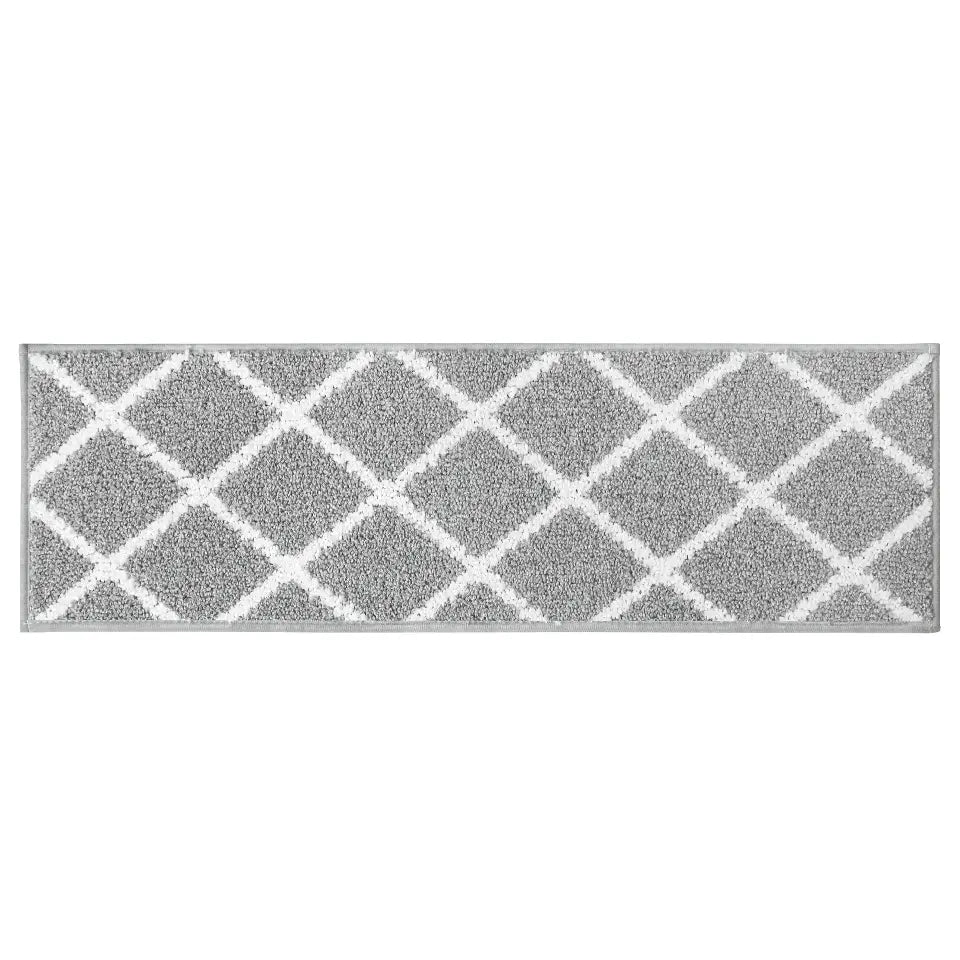 Grey stair treads with white geometric pattern on a white background