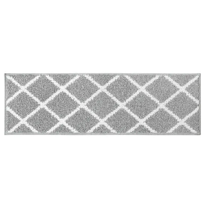 Grey stair treads with white geometric pattern on a white background