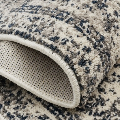 Close-up of a textured rug with a patterned edge
