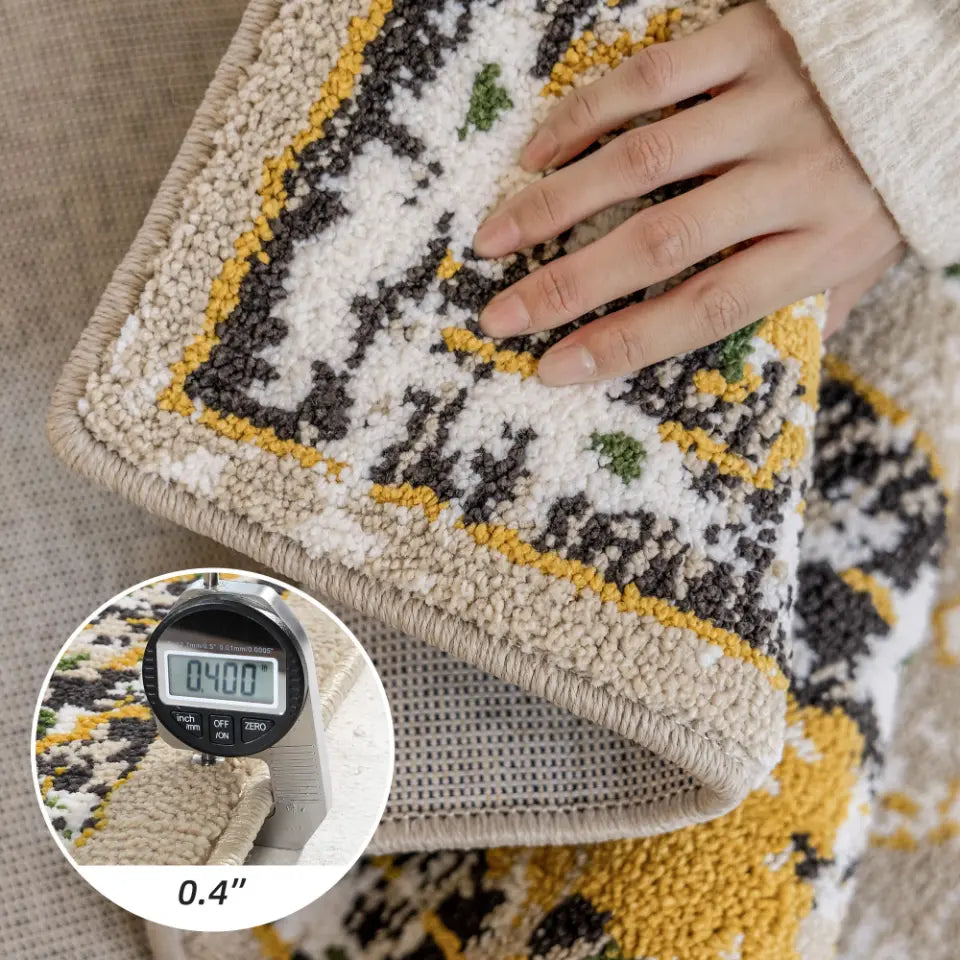 Close-up of a patterned rug with a textured border