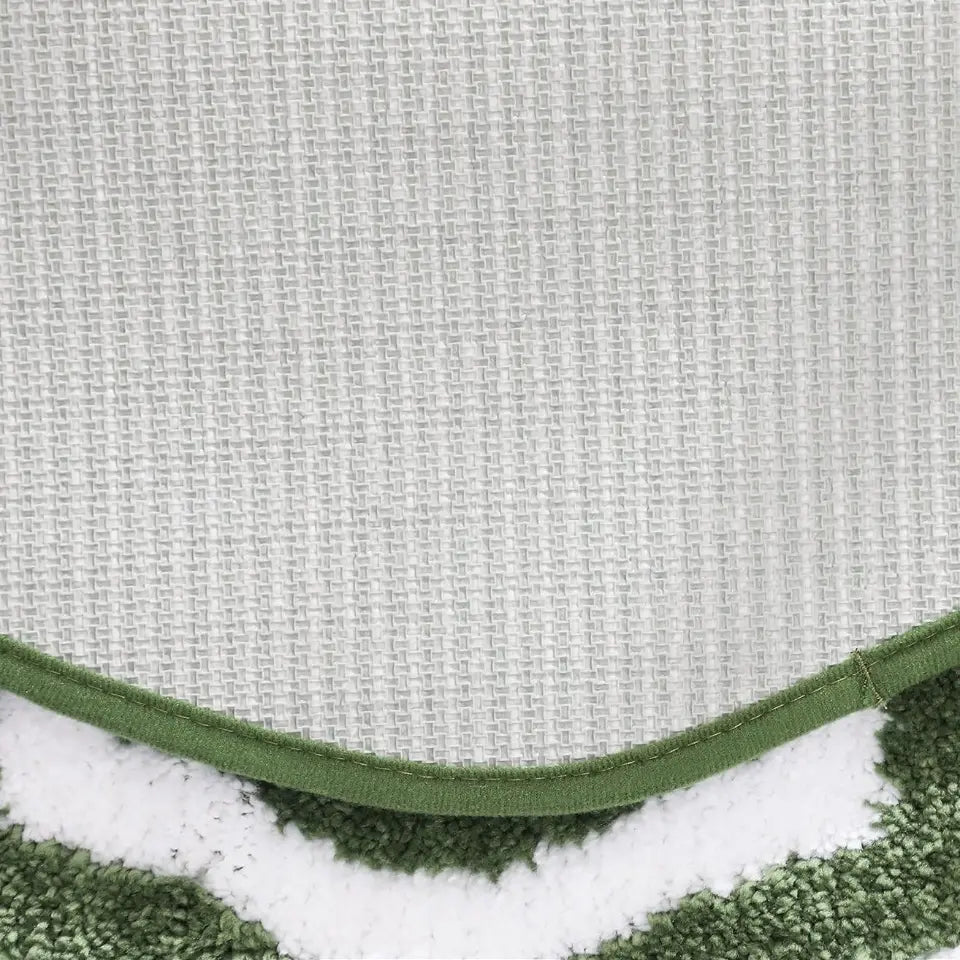 Close-up of a textured fabric with a green border.