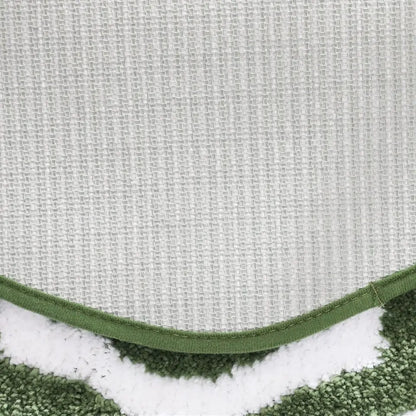 Close-up of a textured fabric with a green border.