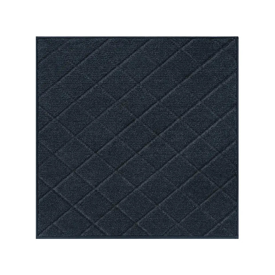 Navy blue textured square stair mat on a white background