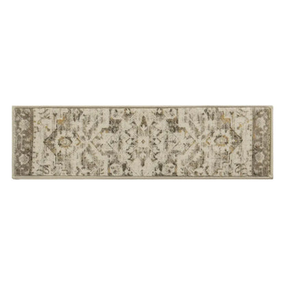 Tan damask patterned rug on a white background